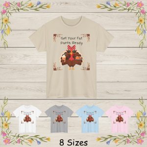 It reads: Get Your Fat Pants Ready This fun and festive illustration features a stylish Thanksgiving turkey dressed to impress! Wearing oversized sunglasses, a bright red polka-dot bow, and a cute floral headband, this fashionable turkey brings a playful twist to fall décor. In one wing, the turkey holds a pumpkin spice drink topped with whipped cream, and in the other, a plate filled with a mini pumpkin and a delicious slice of autumn dessert. The design is framed with rustic fall leaves in each corner, giving it a warm seasonal touch.