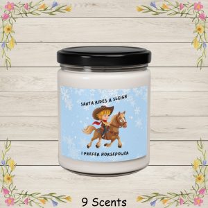 This adorable cartoon illustration reads Santa Rides A Sleigh, I Prefer Horsepower and features a cheerful young cowboy riding a galloping horse, complete with a wide-brimmed hat, red bandana, and classic western outfit.